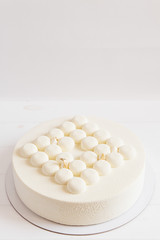 Fototapeta na wymiar White wedding cake on white background