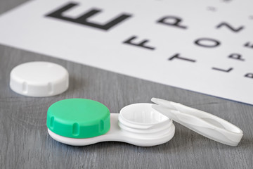 Container for contact lenses, tweezers