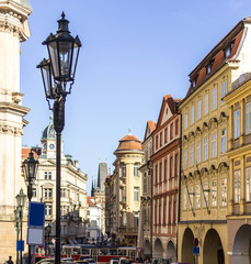 Fototapeta na wymiar The street with old lantern leading to Charles bridge . The nineteenth century. The Old Town District . Prague , Czech Republic.