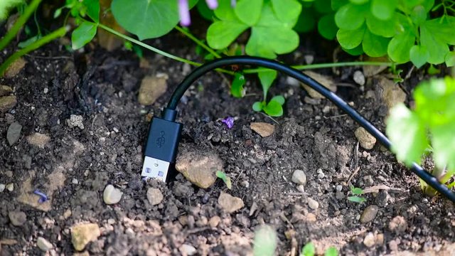 Usb socket with cable plugged into ground