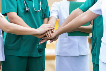 Doctors and nurses coordinate hands. Concept Teamwork