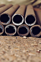 Background of pieces of metal rusty pipes