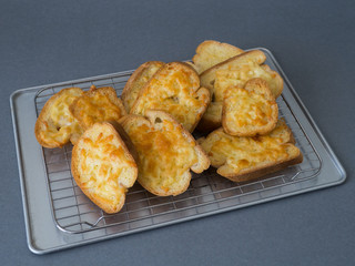 bread cheese on tray and grey background