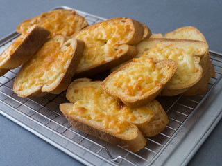 bread cheese on tray and grey background