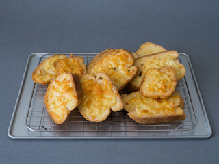bread cheese on tray and grey background