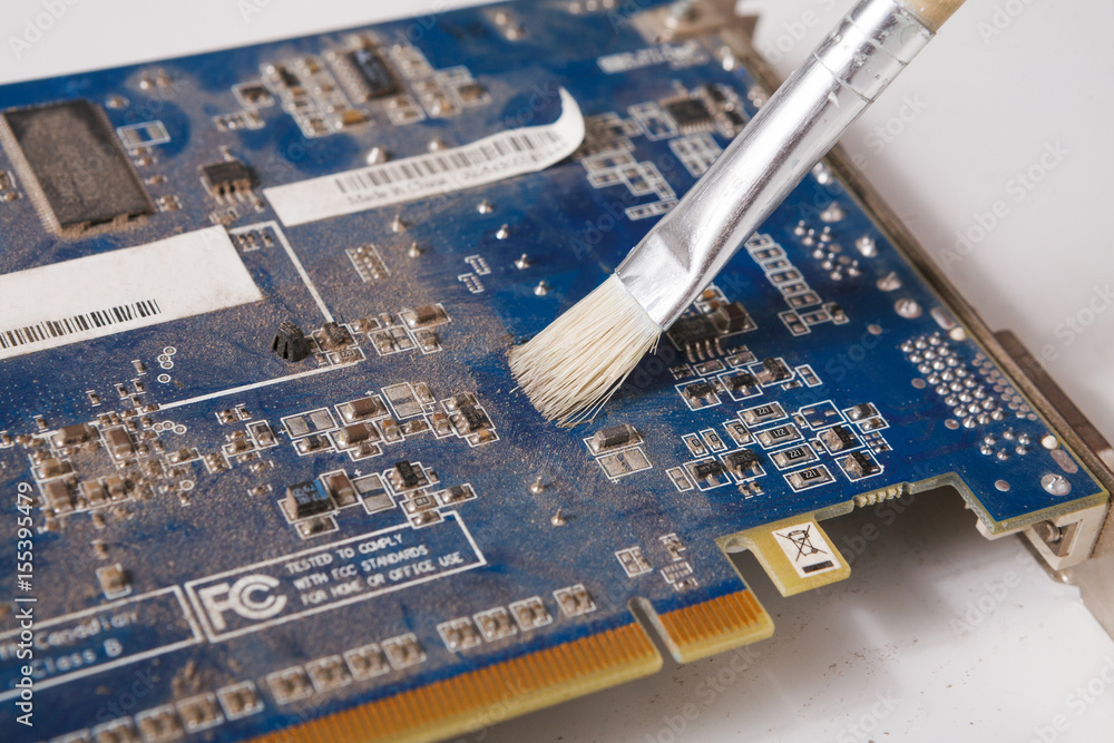 Poster Cleaning computer components close up