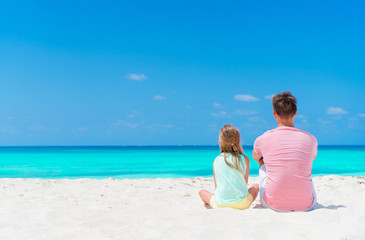 Father and his adorable little daughter at tropical beach