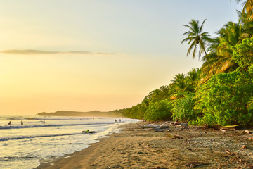 Sunset at paradise beach in Uvita, Costa Rica - beautiful beaches and tropical forest at pacific...