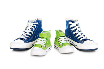 Two pair of a modern sport shoes for adult and kid.