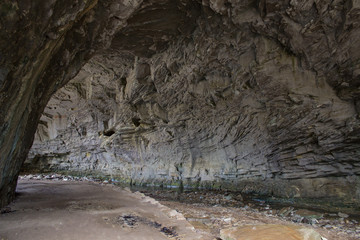 Carter Caves State Park. Hiking trail winds through the tunnel of a Kentucky cave in Carter Caves...
