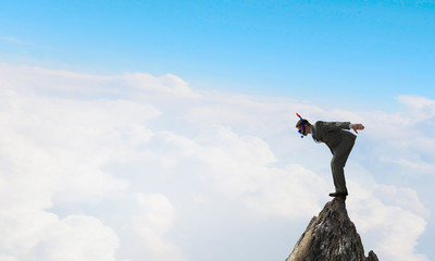 Businessman diving from top . Mixed media