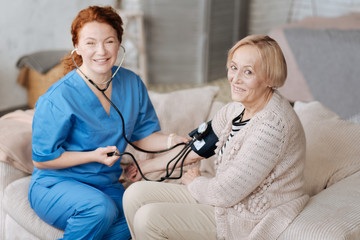 Lively mature lady having a visitor from hospital