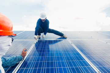 engineer and electrician team swapping and install solar panel ; electrician team checking hot spot...