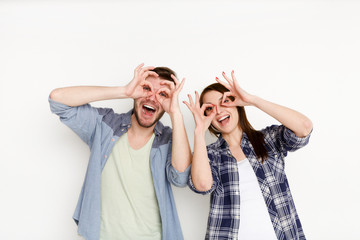 Casual couple having fun, studio portrait