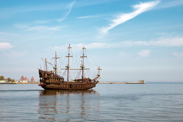 A pirate ship sailing out of the harbor