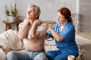 Dedicated motivated doctor conducting medical testing