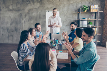 Gret job! Successful business team is clapping their hands in modern workstation, celebrating the performance of new product - obrazy, fototapety, plakaty