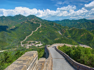 Perspective view on famous beautiful ancient Great Wall of China monument made of bricks stones. Old China architecture. China holidays vacation tours trips travel tourism. Famous sightseeing point