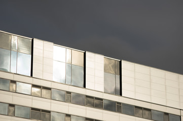 Bright sunshine reflects off building