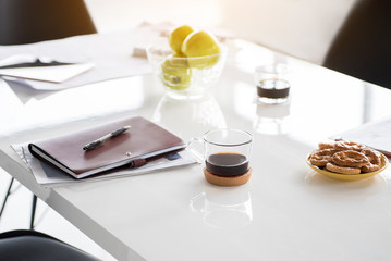 Notebook is nearby light snack