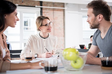 Cheerful smiling colleagues in office