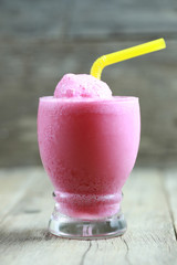 Strawberry Smoothies in Glass on foods table floor.