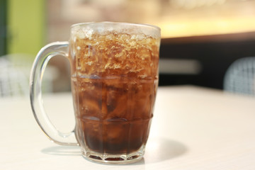 Coca Cola glass on the food table.