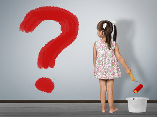 Kid question concept. Child girl draws question mark on wall - obrazy, fototapety, plakaty