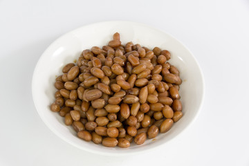peanuts on white plate isolated on white background