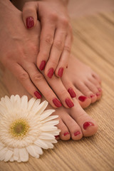 Obraz na płótnie Canvas female feet and hands at spa salon