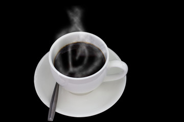 Black coffee in white cup on dark background