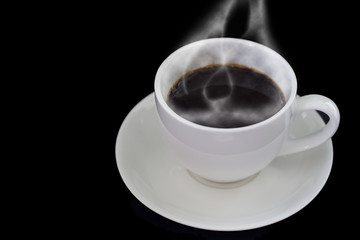 Black coffee in white cup on dark background
