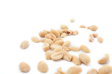 Fototapeta na wymiar Fried salted peanuts on white background. snack