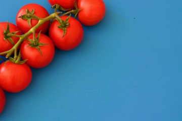 Red tomatoes on the blue table