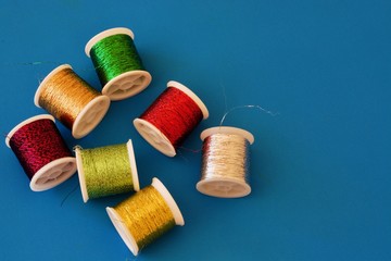 Colourful coil of thread on the white table