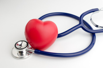 red heart and a stethoscope on white background, health care medical technology concept, soft focus, selective focus.