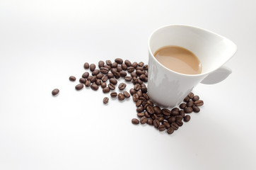 coffee beans and white coffee cup isolated on white background