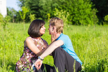 Fototapeta premium Happy pregnant woman and her husband in the park.