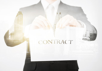close up of businessman holding contract paper