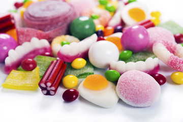 Colorful candies, jelly and marmalade on white background 