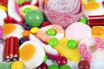 Fototapeta na wymiar colorful candies and jellies background