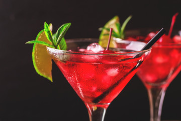 Strawberry daiquiri cocktail with lime, strawberry, cherry and mint