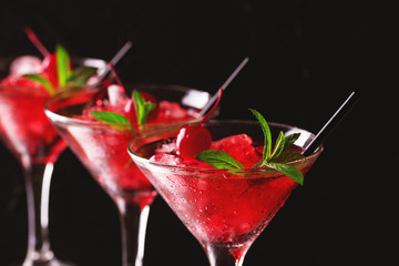 Strawberry daiquiri cocktail with lime, strawberry, cherry and mint