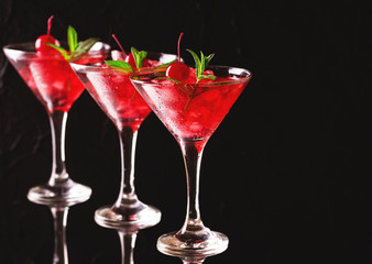 Strawberry daiquiri cocktail with lime, strawberry, cherry and mint