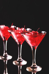 Strawberry daiquiri cocktail with lime, strawberry, cherry and mint