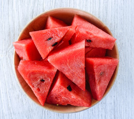 water melon in wood bowl on table