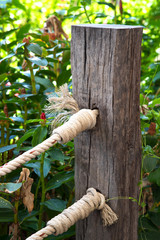 Wooden fence and knot rope
