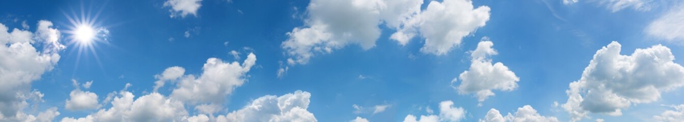 Naklejka na ściany i meble Sky panorama with sun and clouds