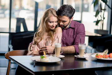 romantic couple in love spending time together on coffee break in restaurant