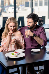 romantic couple in love spending time together on coffee break in restaurant